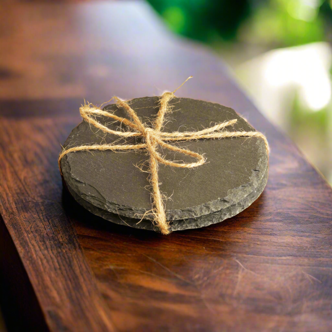 Round slate stone with twine on a wooden surface