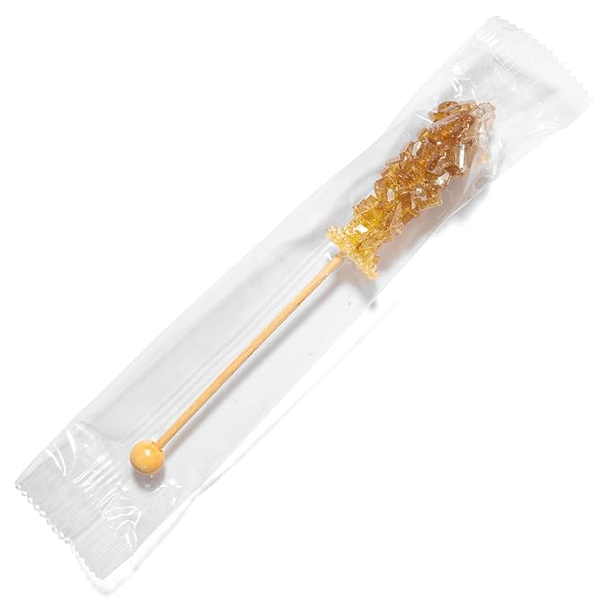 Sugar stick in a clear plastic packaging on a white background