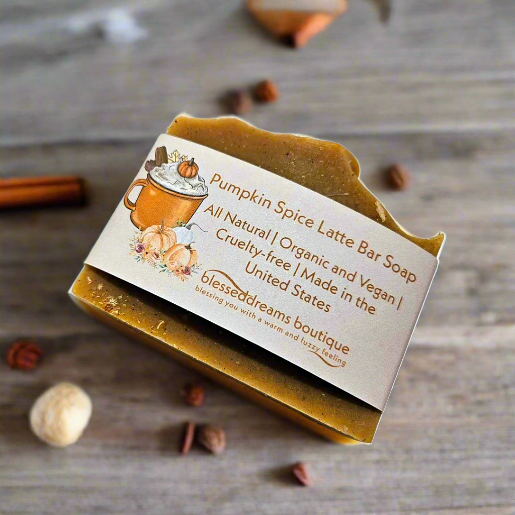 Pumpkin Spice Latte Bar Soap with a label on a wooden surface with spices.
