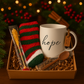 White mug with 'hope' text, red and green striped socks, chocolate spoon, and a sugar stick candy in a gift box.