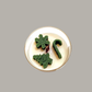 Yuletide Bliss - Wood Wick Soy Candle with green tree, cane and snowflake christmas decor on top of the candle.